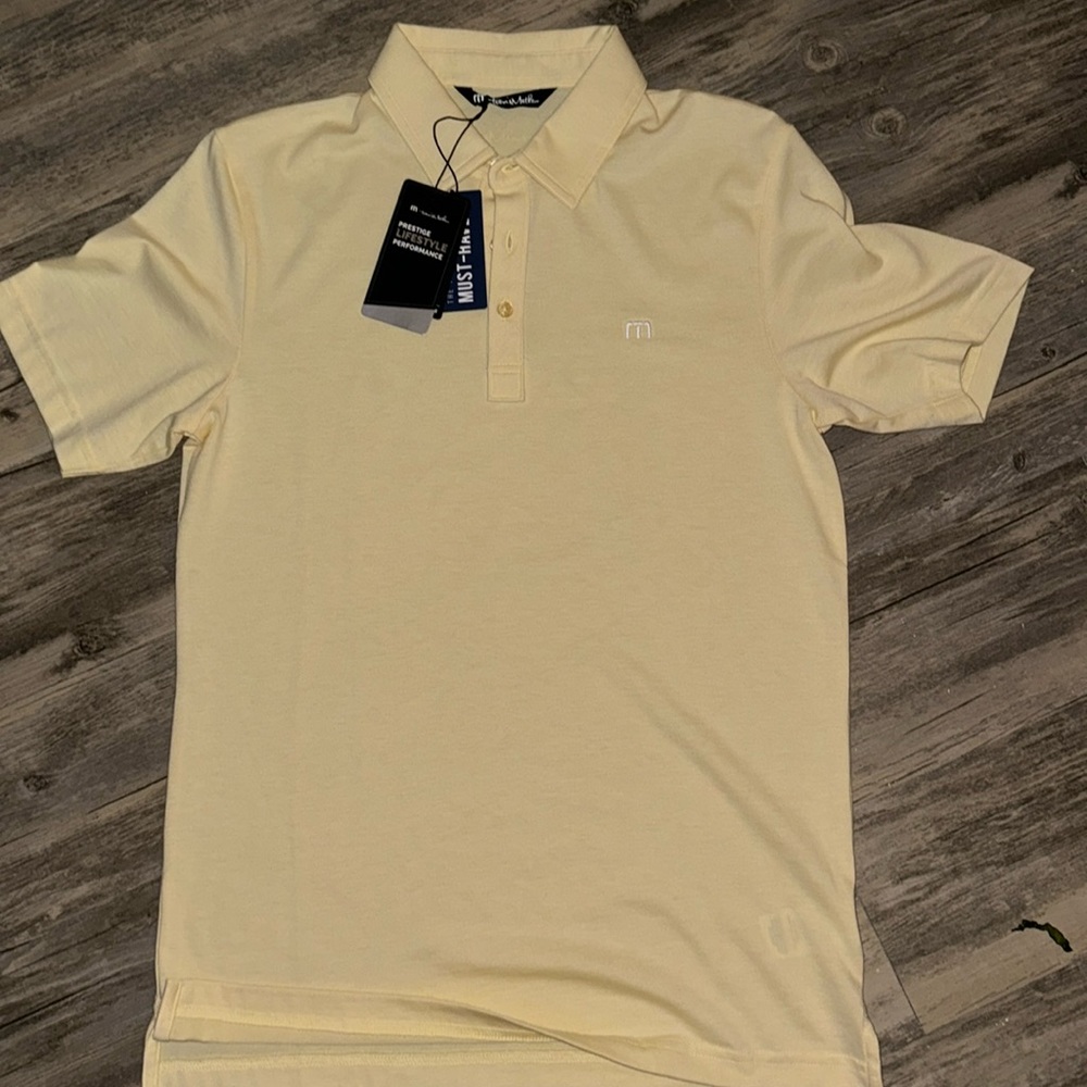 Brand new yellow Travis Matthew polo. Never worn with tags